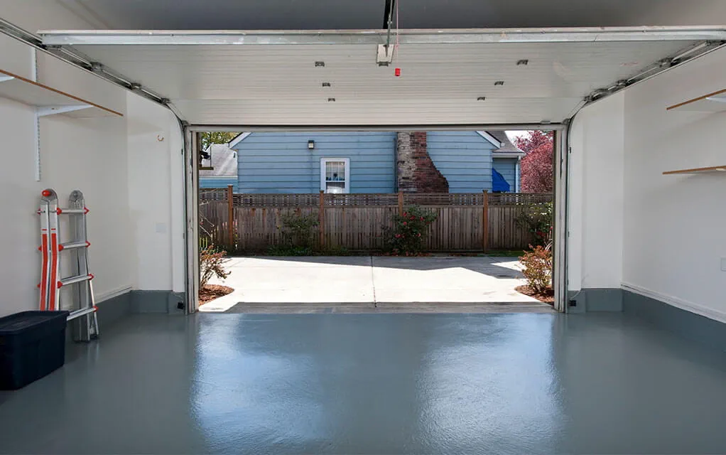 View from inside a garage to the outside with a clean and uncluttered interior