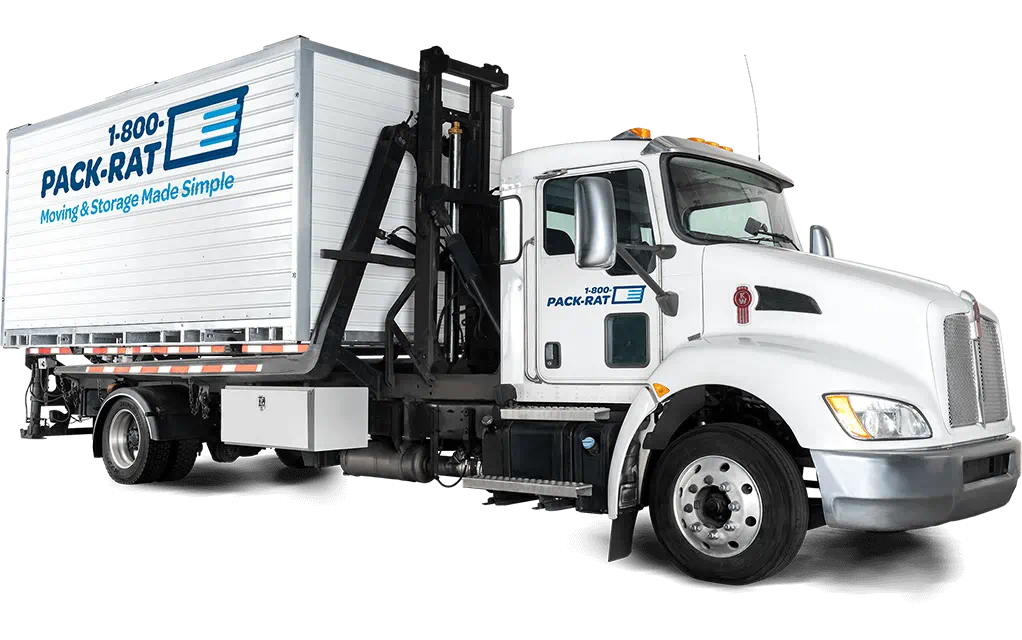 View of a loaded 1-800-PACK-RAT mini-mover truck with a container on the back ready to be delivered