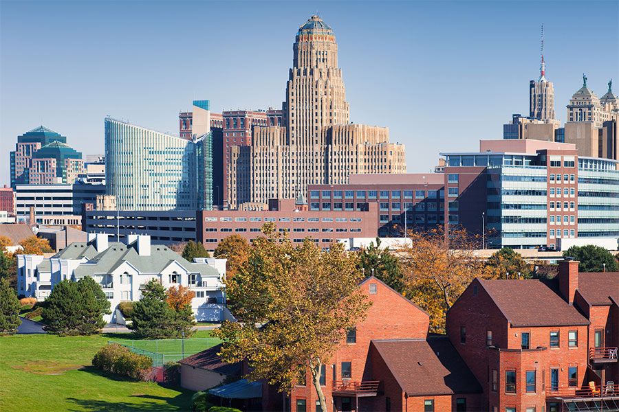 A view of the downtown Buffalo, NY skyline during midday on a mostly sunny day