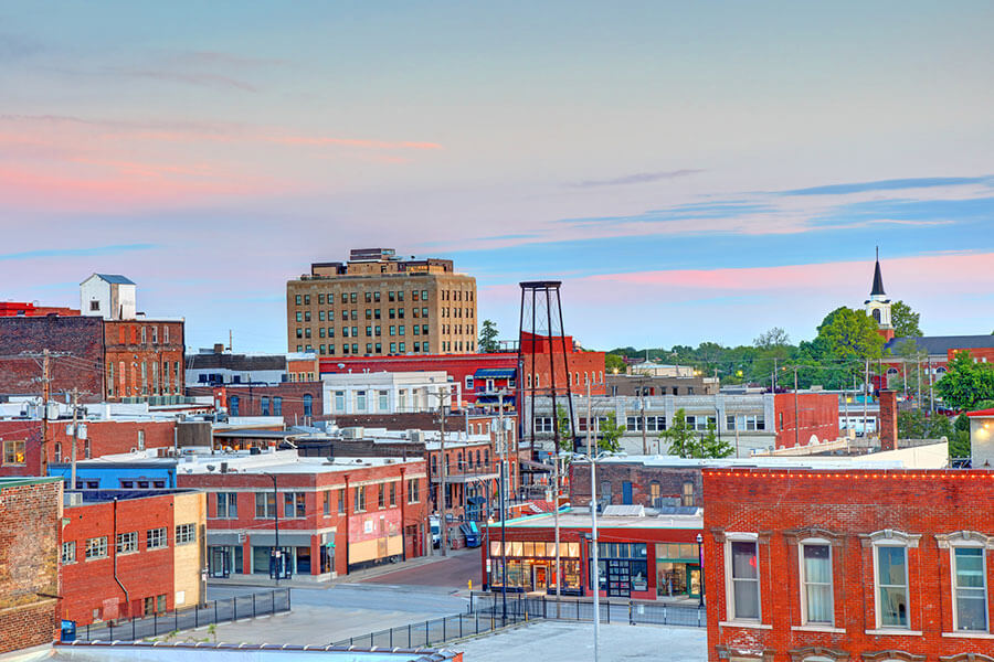 A view of the downtown Springfield, MO cityscape on a clear dusk evening